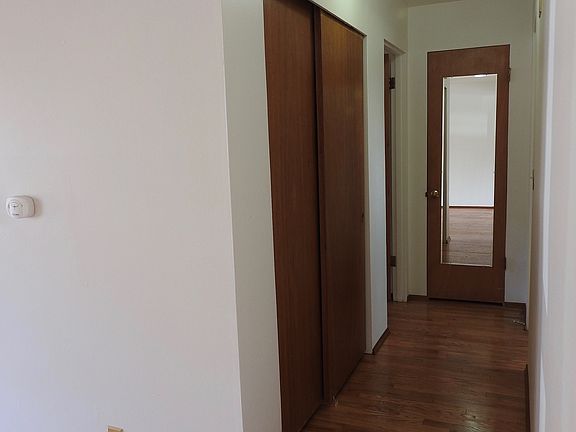hall with closet and linen closet