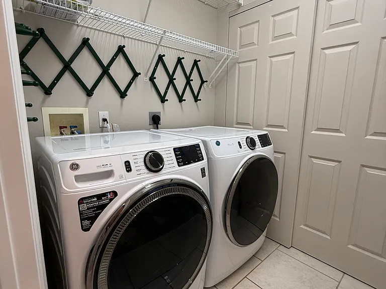 Brand new washer/dyer/hot water tank in separate laundry room