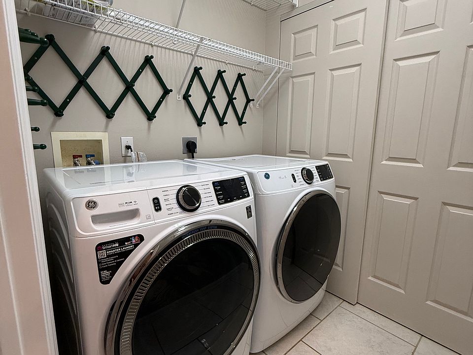 Brand new washer/dyer/hot water tank in separate laundry room