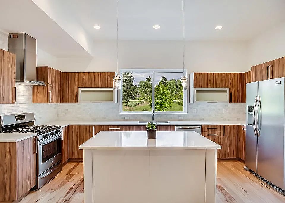 Kitchen with gas range, new appliances, and beautiful finishes.