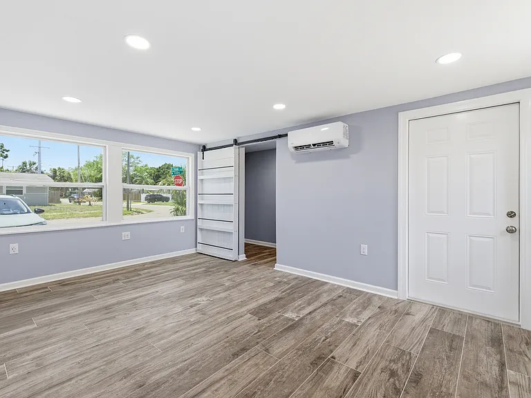 Bonus room and laundry access. Great for an office, play room, or dining room.