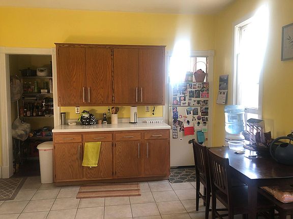 The walk in pantry (the door way on the left) runs behind this wall of the kitchen. Lots of storage!