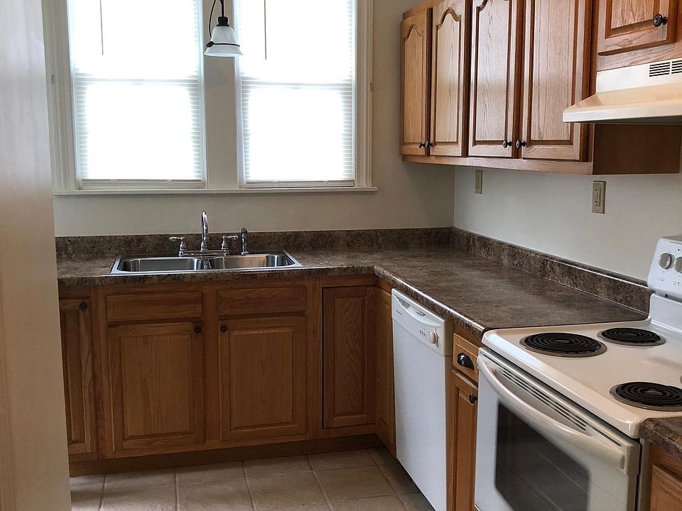 Kitchen with Range, Dishwasher & Refrigerator.