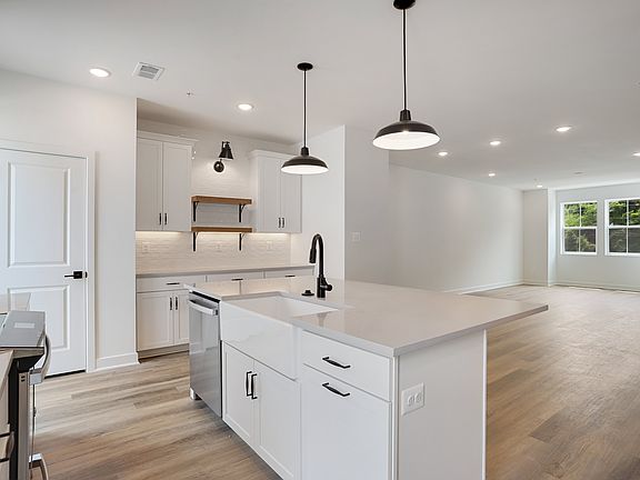 Kitchen with stylish floating shelves