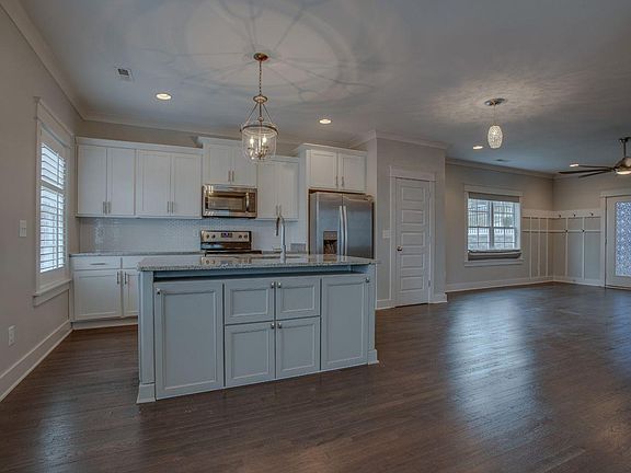 Dining area view of kitchen and living room.