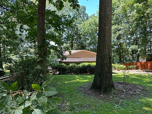 Front of house and front yard from corner of yard