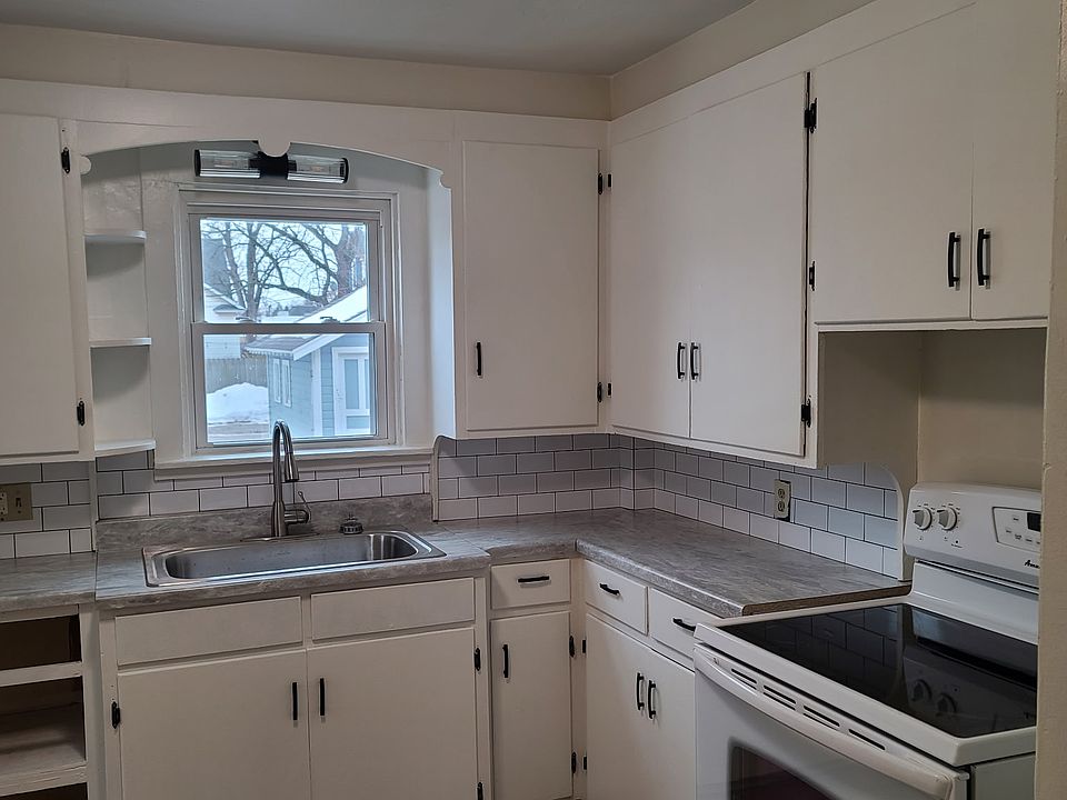 Kitchen, with new flooring, paint, countertops and lighting