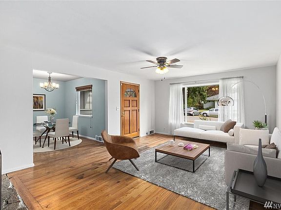 Let the sun shine in through the large living room window.
