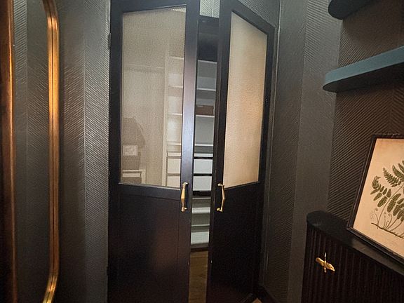 Changing area with access to clothes closet and bathroom