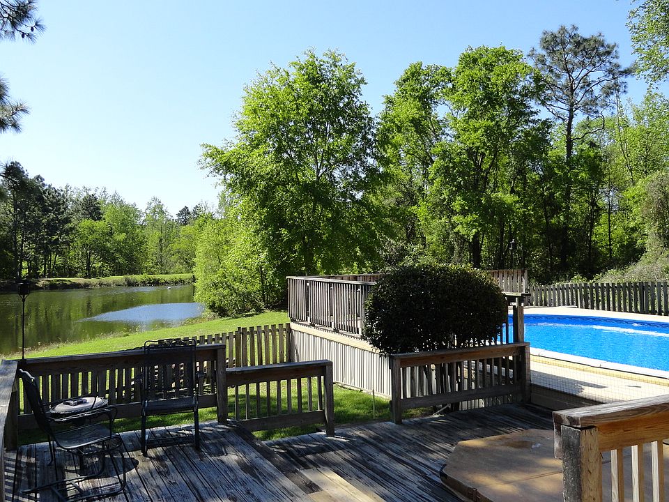 view of lake and pool.