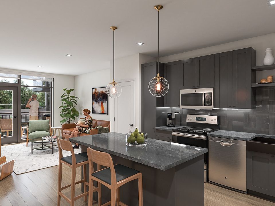 a kitchen and living area in a 555 waverly unit