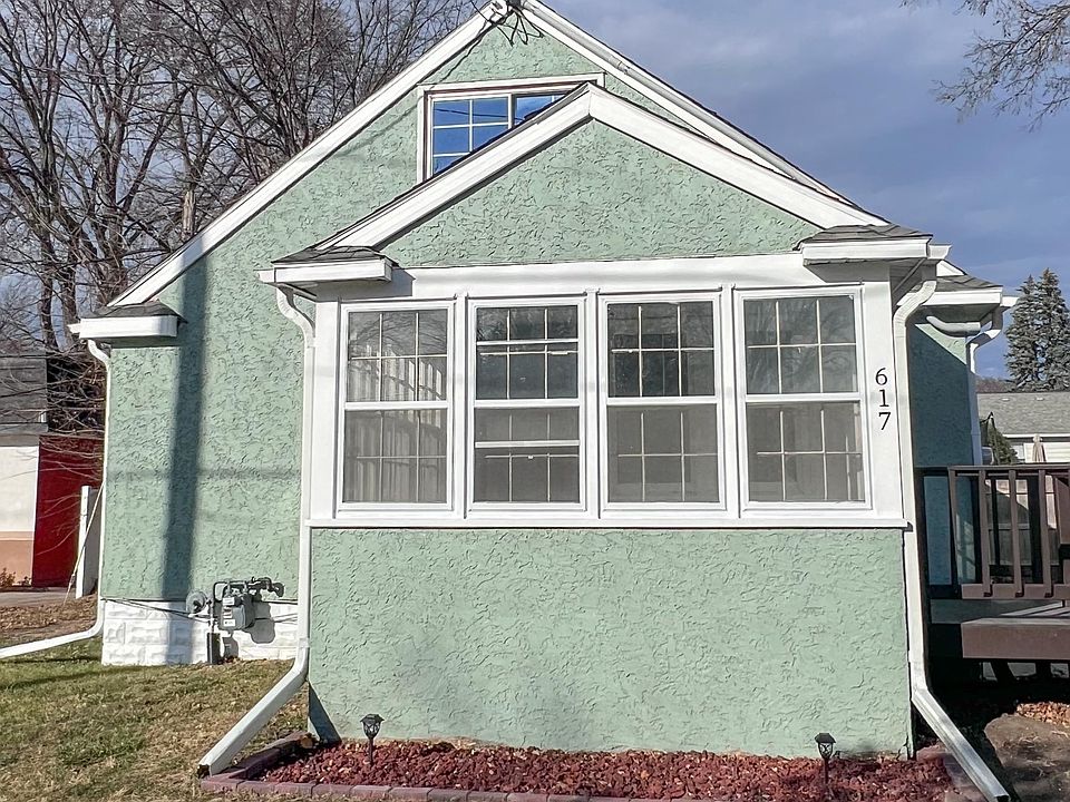 Large enclosed porch. Flower bed ready for you to show off your green thumb.