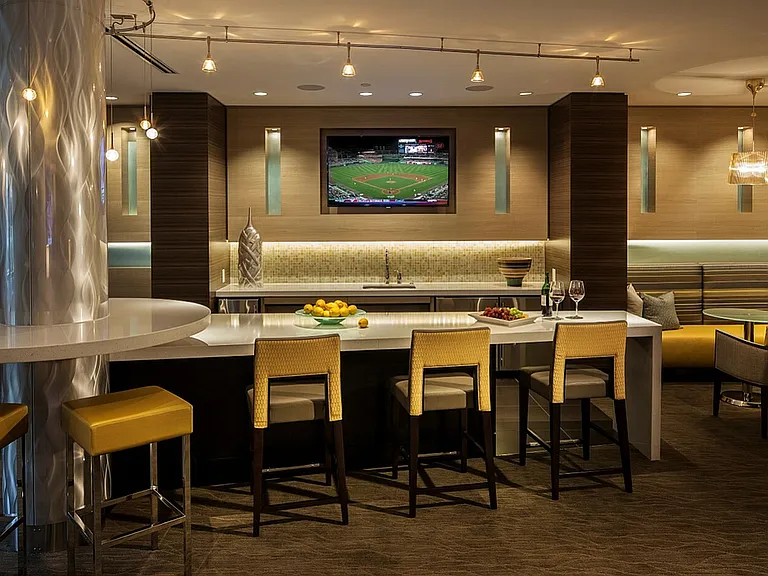 Contemporary Club Room With Bar Area, TV & Numerous Seating Areas