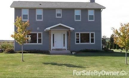 House facing East, views of woods & pond
						:
						2.42 acres with this property and scenic views in every direction.