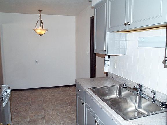 View of dining area, chandelier on dimmer.