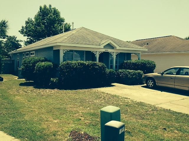 Front of Home. Parking for 2 cars side by side. No Garage but has shed in backyard