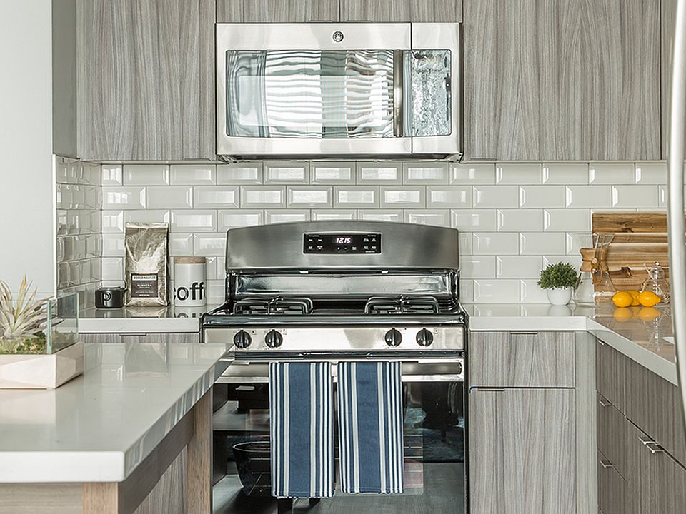 State-of-the-art kitchens with stainless steel appliances, can lighting, and contemporary faucets and sinks