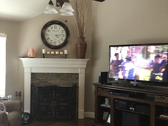 Living room with wood burning fireplace