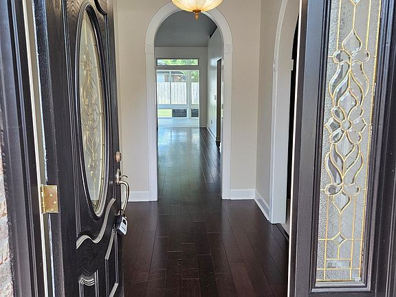 Front entrance hallway to kitchen and open living room.
