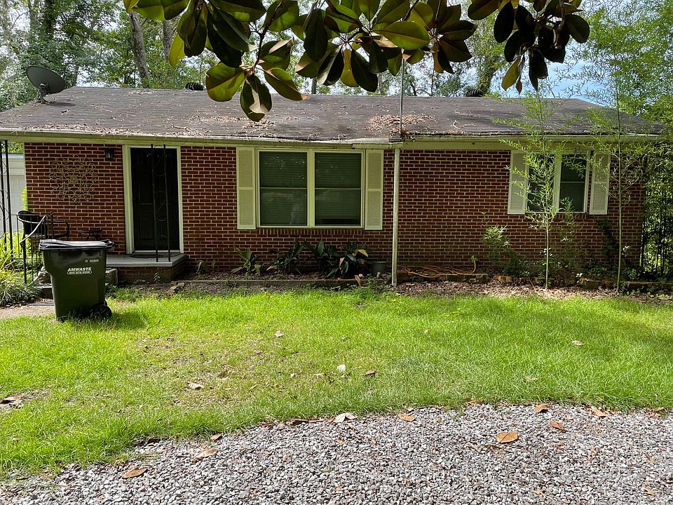 Front of house with circle driveway