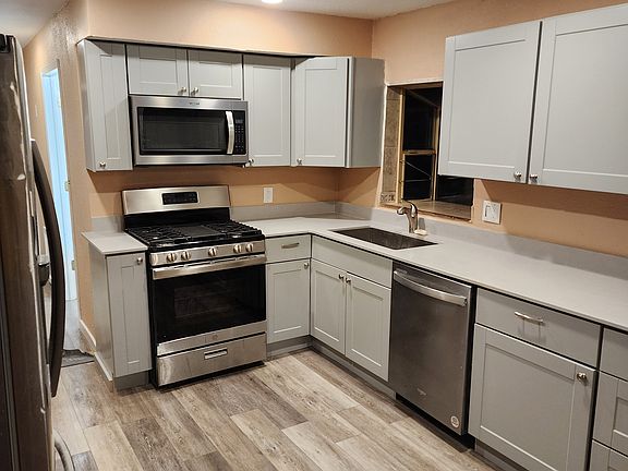 new kitchen with granite countertop