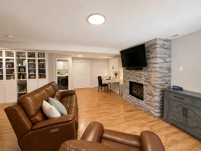 Family Room - Daylit Basement - Gas Fireplace - Large amount of Storage - Murphy Bed/Desk Office Area interchangeable - Adaptable for use as a Guest Suite with its own Bathroom.