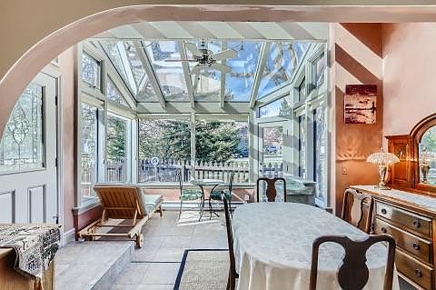 view of dining room and glass sunroom