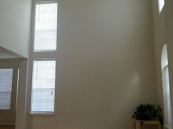 Den with 2-story high ceiling