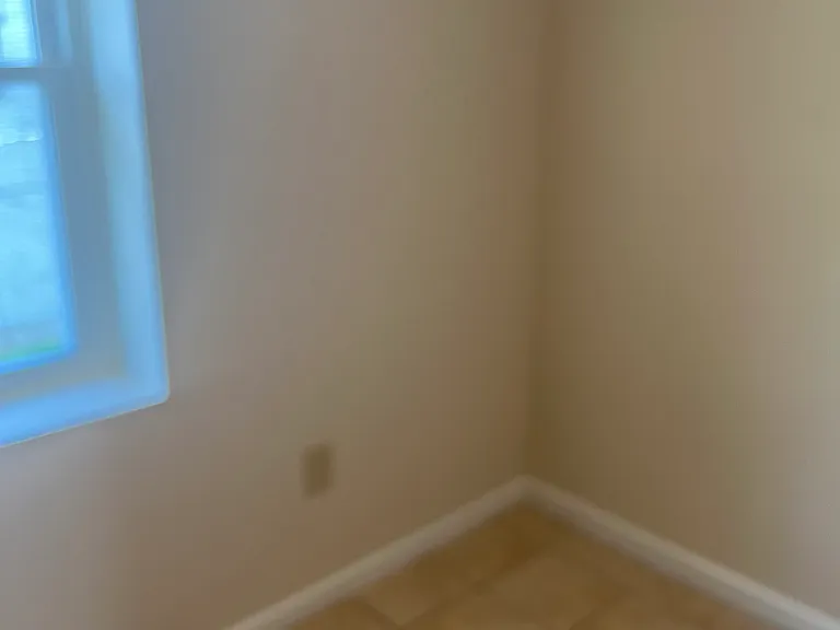 The kitchen is tiled
