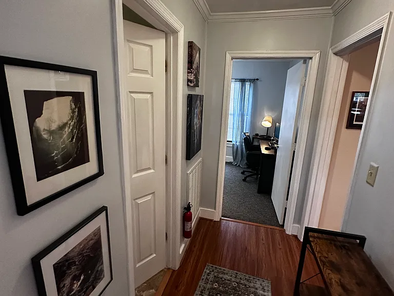 Looking down hallway towards front bedroom with the bath on the left.