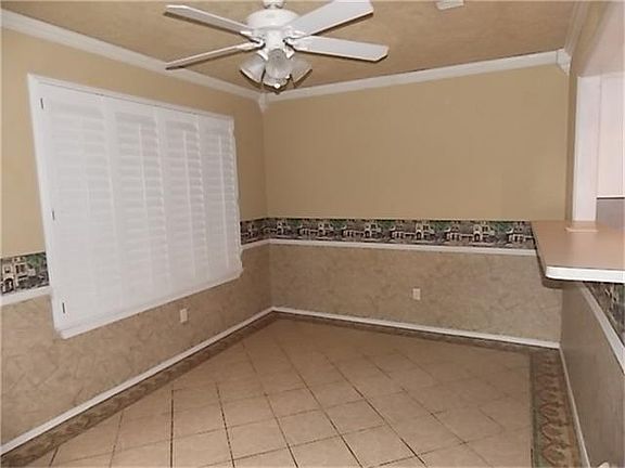 BREAKFAST ROOM WITH TILE FLOORS