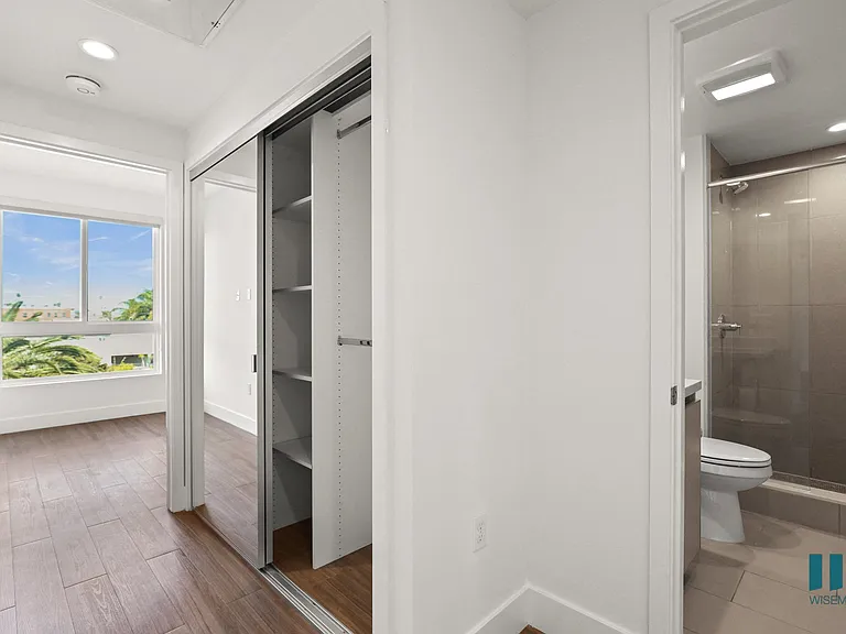 Bedroom with Bathroom and Closet with Shelving