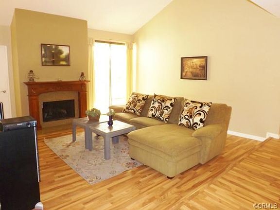 Your living room is bright and spacious. Vaulted ceilings and d