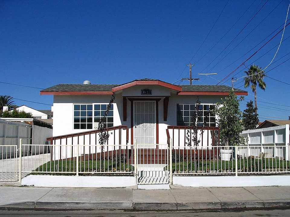 Welcome Home - property is fully fenced on a corner lot w/alley access on side