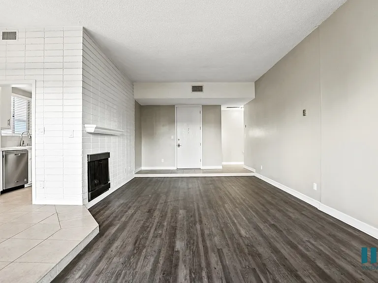 Living Room with Storage Closet and Vinyl Flooring