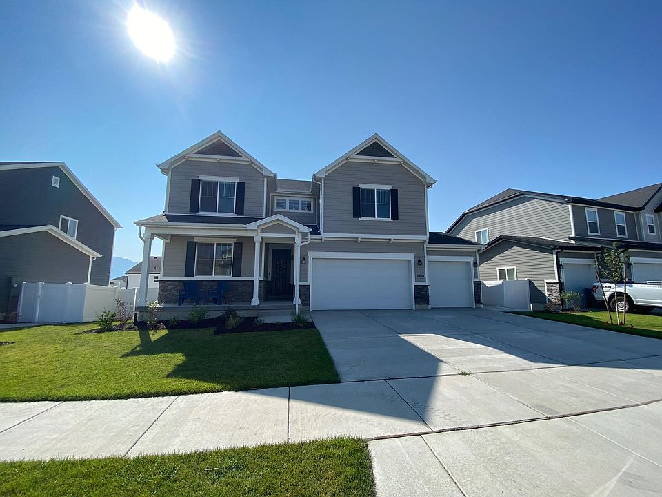 Front of house - your entrance is through the gate around the right side of the garage, and your parking space is in front of the far right garage door