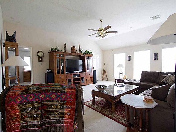 The large game room is surrounded by four good size bedrooms.