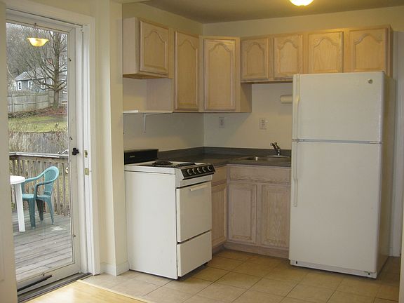 Tile floor in kitchen with door to deck