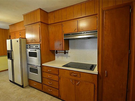 KITCHEN HAS BEEN REMODELED AT SOME POINT. DOUBLE WALL OVEN.