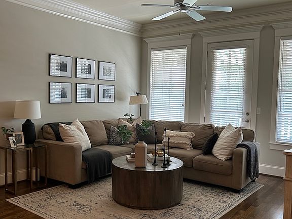 Spacious main living area with access to private balcony.