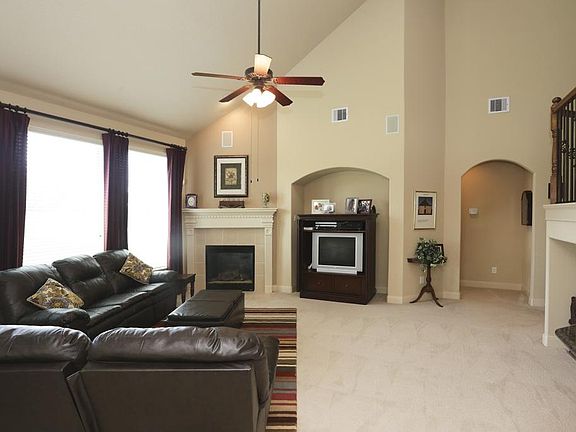 Family room soaring ceiling emphasizes spaciousness.