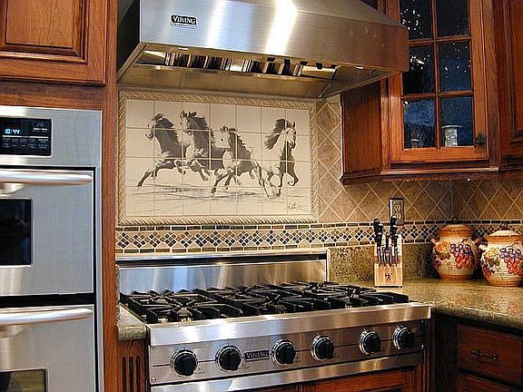 New viking cooktop and custom horse motif tile backsplash.
