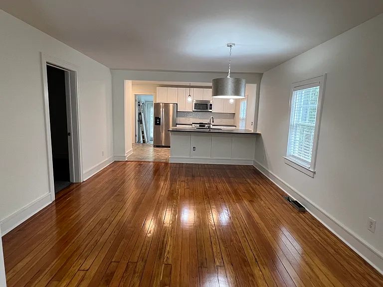 Large enough dining area for table and chairs, as well as bar chairs at kitchen counter