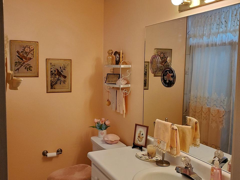 Full bath has a walk in shower for easy accessibility with a large linen closet.