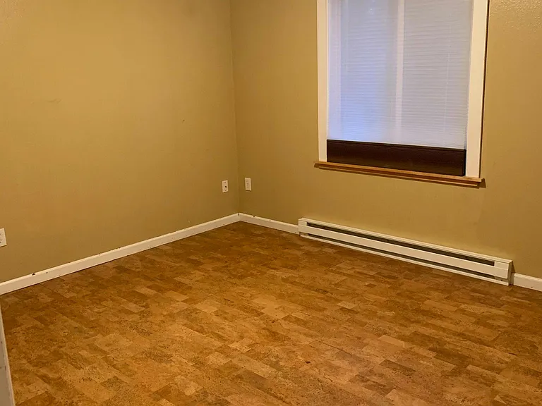 Additional upstairs bedroom with cork flooring and insulated black out/sheer window shade