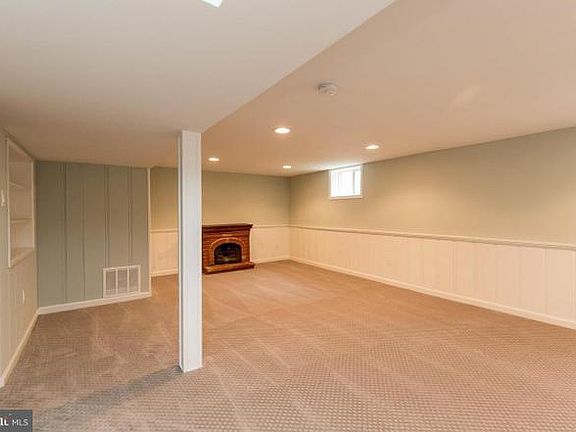 One side of basement. The fireplace is no longer there, it has been removed.