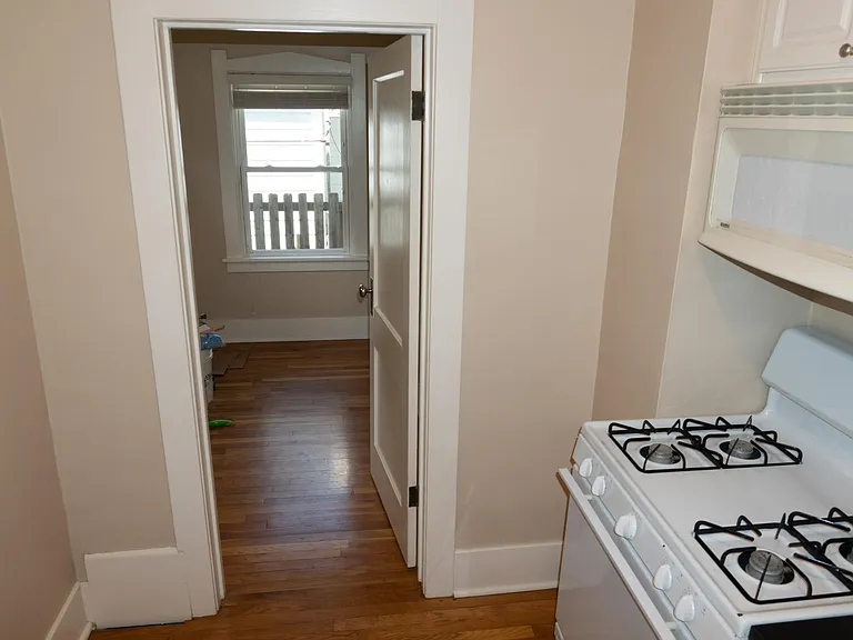 Doorway from the kitchen to the back bedroom.