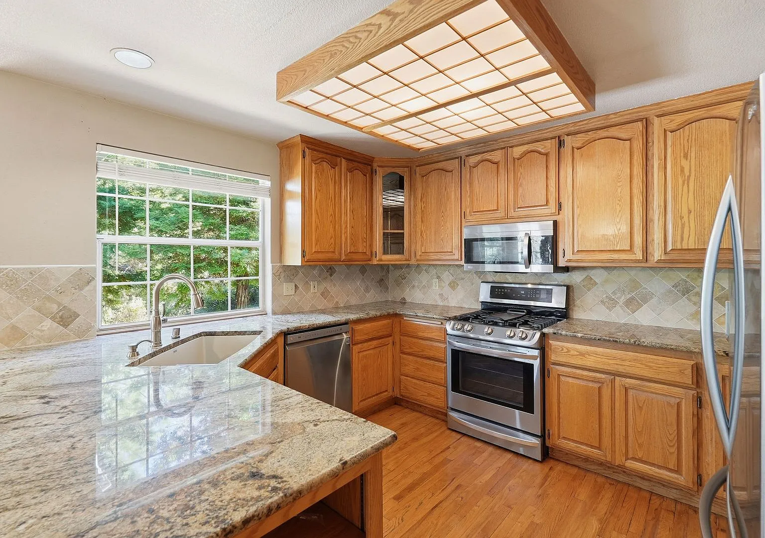 4-Bedroom Home with Wraparound Deck, 3-Car Garage & Private Setting! — Photo 3