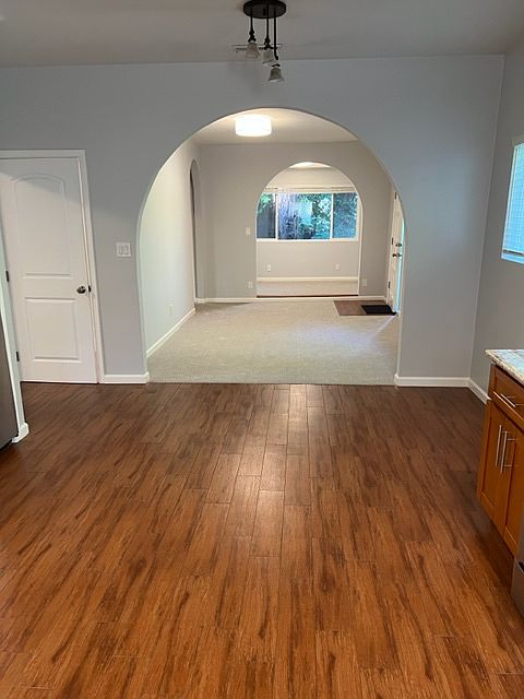 Tile floor in kitchen
Middle room is the living space
The far end is the bonus room