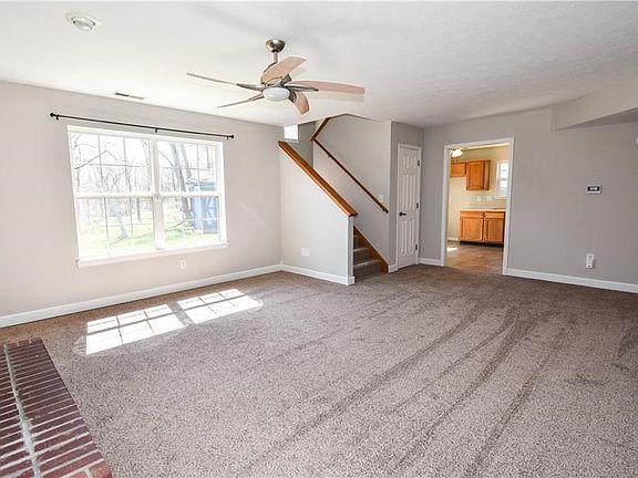 Living room with Gas Fireplace & Brand new fresh carpet.